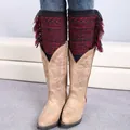 Close-up of bohemian knit leg warmers with vintage jacquard and tassel details - Black/Wine Red