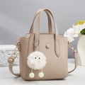 Minimalist beige pebble leather tote bag with a cute plush monster charm and top handles - Khaki