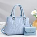 Light blue pleated tote bag with matching envelope clutch and gold hardware details - Blue