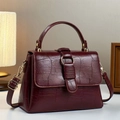 Deep burgundy croc-effect leather handbag with gold metal ring and top handle strap - Burgundy
