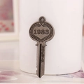Retro DIY key pendant in dark bronze with heart-shaped top and engraved 1983 energy text - Key D