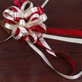 Top view of a large bicolor red and beige ribbon bow for gift and car decoration - Burgundy