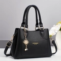 Elegant black lychee grain leather handbag with gold hardware and pearl charm - Black / 28x13x20cm