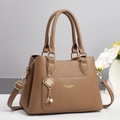 Elegant brown pebbled leather handbag with gold hardware and decorative pearl pendant charm - Khaki / 28x13x20cm
