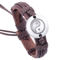 Retro brown braided leather bracelet featuring a silver Tai Chi pendant on white background - Brown