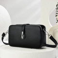 Classic black litchi grain leather crossbody bag on a textured display stand - Black