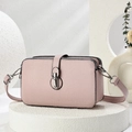 Pink pebbled leather crossbody bag with silver buckle and adjustable shoulder strap - Pink