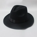 Detailed view of black wool jazz fedora hat featuring a satin ribbon and side knot - Black