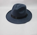 Detail of navy blue wool fedora hat featuring a classic black ribbon band and elegant brim - Dark Blue