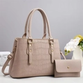 Detail view of retro crocodile pattern tote bag set with matching wallet and gold hardware - Off-white
