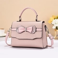Pink crossbody bag with a chic bow and woven texture for a stylish everyday look - Pink