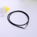 Minimalist black rubber cord necklace with silver s925 lobster clasp on white background - 1.5mm Thick x 40cm Long