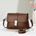 Minimalist brown pebbled leather shoulder bag with silver buckle and adjustable strap - Coffee