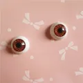 Vue macro des yeux de poupée BJD 12mm avec iris brun et texture radiale réaliste - Marron