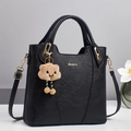 Elegant black faux leather tote bag with gold hardware and a cute cloud charm pendant - Black