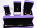 Elegant purple velvet jewelry box set with rings, necklaces, and bracelets on black lining - Purple Pendant Box