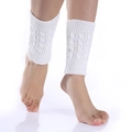 Detail of white cable knit leg warmers with textured twist pattern and ribbed elastic cuffs - One Size / White