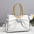Detail of white handbag with large crystal bow, crocodile texture and golden handle - White