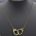 Retro bronze freedom handcuff pendant necklace for women on black jewelry display stand - Antique Bronze Necklace (1447)