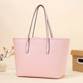 Pink lychee texture tote bag with silver studs and black handles for daily commuting - Pink