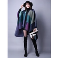 Detail shot of a color block knit poncho wrap with navy, green, and purple geometric panels - Purple