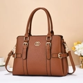 Detail of brown litchi pattern leather tote with golden hardware and adjustable strap - Khaki/Earth Yellow