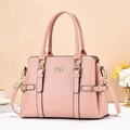 Detail view of pink lychee textured tote bag with golden metal logo and buckle decoration - Pink