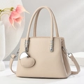 Elegant cream leather tote bag with heart charm and adjustable strap for women - Light Khaki