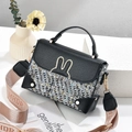 Women's square crossbody bag featuring tweed patchwork and gold rabbit ear detail - Black