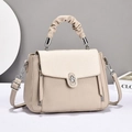 Fashionable beige crossbody handbag with textured leather finish and top handle - Light Khaki