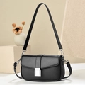 Detail of black woven texture bag featuring silver square lock and dual shoulder straps - Black