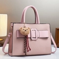 Pink textured leather bag with a plush bear charm and adjustable shoulder strap - Single Piece / Pink