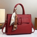 Elegant red leather handbag with top handle and silk scarf detail for women - Red