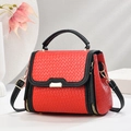 Retro tote bag in red woven texture with black trim and gold buckle details - Red