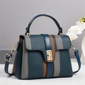 Navy blue crossbody bag with orange stripes and gold lock on minimalist background - L24 W11 H17 / Blue