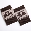 Close-up of thick knitted leg warmers with reindeer jacquard and ribbed cuffs in brown - Dark Coffee/Beige