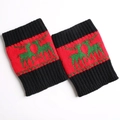 Close-up of Christmas knit leg warmers with green reindeer pattern and ribbed cuffs - Red/Green Reindeer/Black