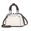 Close-up of litchi texture cream handbag with brown handles and silver zipper details - Off-white