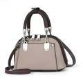Detail of multi-pocket tote bag showing grainy texture and silver hardware accents - Gray