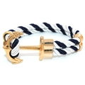 Braided nautical rope bracelet with gold anchor and dolphin charms on white backdrop - Gold Anchor - Blue White Striped Rope