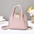 Pink lychee leather shell handbag with double handles and gold chain shoulder strap - Pink