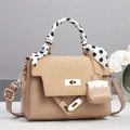 Detail of khaki leather handbag with straw texture flap and polka dot scarf handle - Khaki