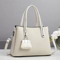 Elegante ivoren geweven draagtas voor dames met leren handvatten en schouderriem - Off-wit