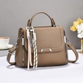 Brown litchi grain leather crossbody handbag with woven pendant and adjustable strap - Dark Khaki