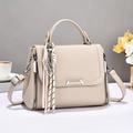 Beige faux leather crossbody bag with top handle and decorative metal abacus charm - Light Khaki