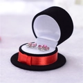 Black round top hat jewelry box with a red ribbon and velvet finish for earrings - Black Top Hat