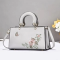 Sac à main brodé gris clair avec motifs floraux et ferrures en métal doré - Gris