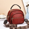 Elegant red pebbled leather shoulder bag with white contrast stitching and jacquard strap - Red