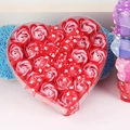 Macro shot of heart-shaped gift box with soap roses and red love ribbon detail - Red Mix