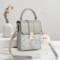 Snakeskin texture square handbag in grey silver with gold lock and plush pendant charm - Gray